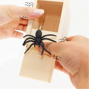 Child laughing with Halloween Spider Prank Box