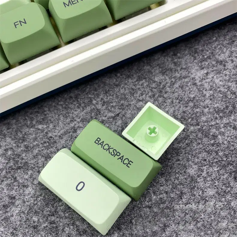 Diverse language Matcha keycaps on a dark keyboard. Multilingual solutions at RockatShip